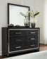 Kaydell King Upholstered Panel Headboard with Mirrored Dresser, Chest and Nightstand